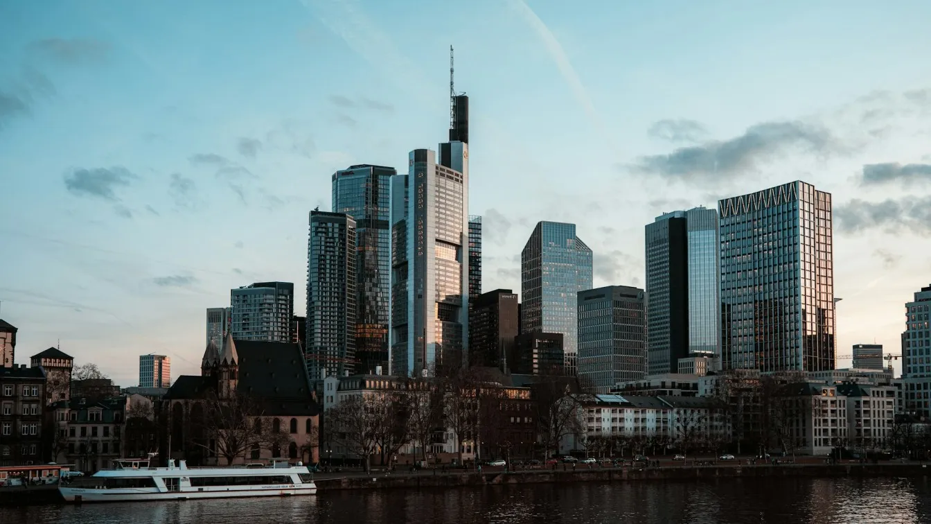 The Frankfurt financial district skyline seen across the river Main at dusk